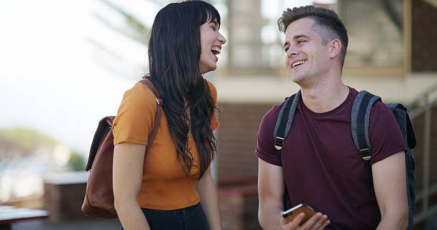 istock Education, laughing and phone with student friends on university campus for conversation or study. App, funny and learning with happy people at college together for academics, development or growth 2236063251