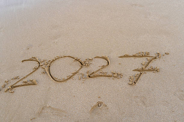 istock 2027 numbers written on sand. 2236067848