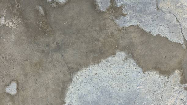 istock Old grey concrete floor with stains, fading, peeling paint, scratches, sidewalk, road surface, texture, and background image. 2236070988