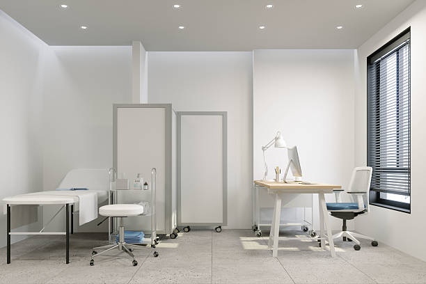 istock Modern Medical Office Interior with Examination Bed and Workspace 2236073717