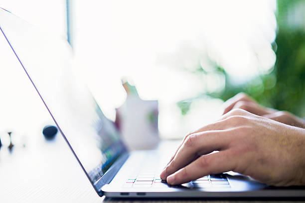istock Hands of business person working on computer 2236074977