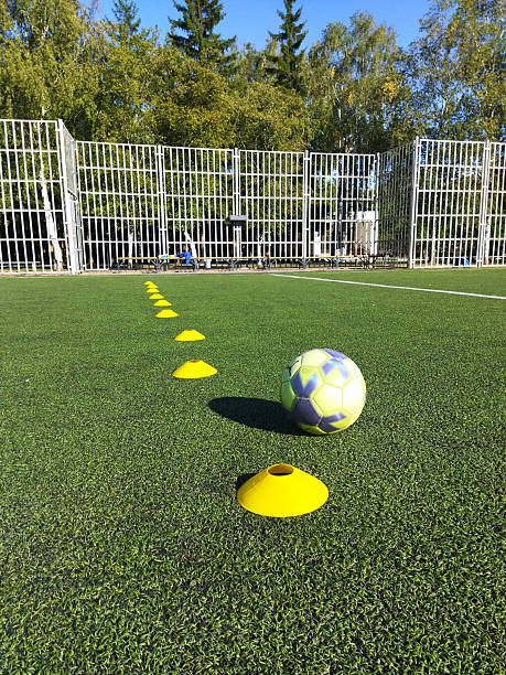 istock Soccer training drills with cones on a sunny day 2236080309