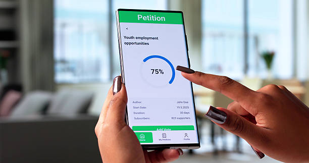 istock Young Woman Signs Online Petition Using Smartphone In Modern Office 2236081498