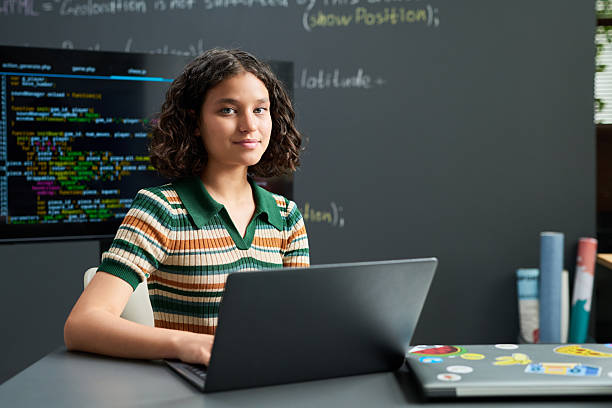 istock Portrait of Teenager Girl Using Laptop While Coding in Classroom 2236082871