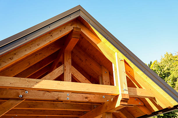 istock Sunlight gently filters through a beautifully constructed wooden roof framework, revealing exposed beams and strong bolts that emphasize the rich grain of natural wood. 2236085820