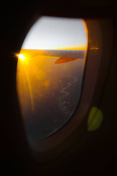 istock Sunset Sky and Clouds Seen from Airplane Window 2236087955