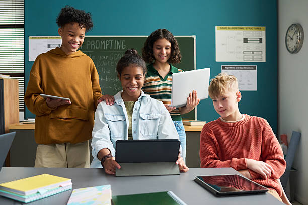 istock Diverse Group of Teenagers Collaborating on Digital Project in Classroom 2236088274