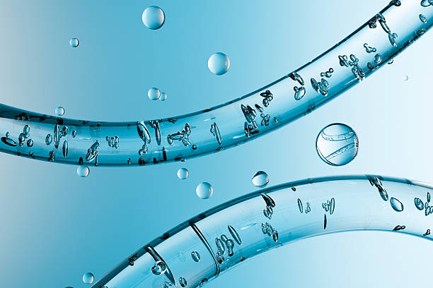 Abstract macro image of water bubbles inside transparent tubes on a blue background. Clean, fresh and futuristic design concept for purity, hydration and science themes.