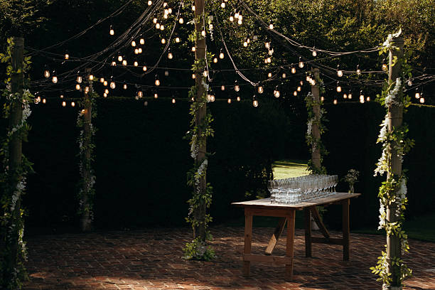 istock Drinking Glasses on Table Under Fairy Lights for Event 2236090367