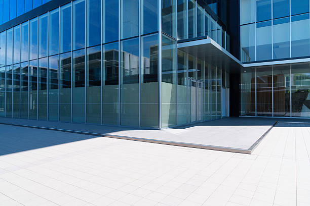 istock modern office building with street in city 2236091002