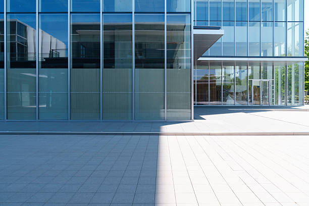 istock modern office building with street in city 2236091016