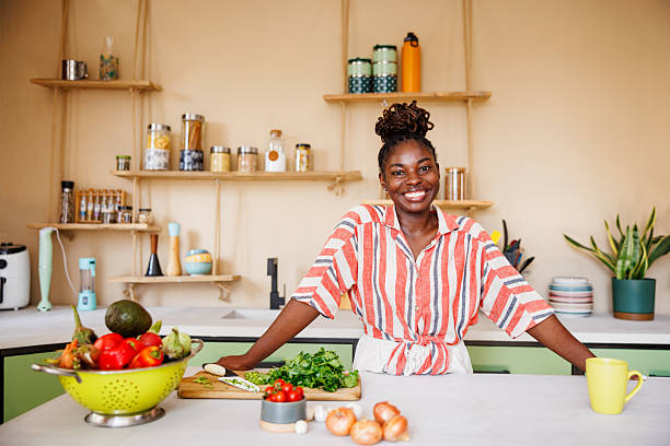 istock Smiling African American Woman Looking at Camera in Kitchen 2236091316