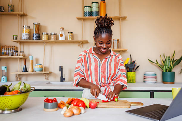 istock Home Chef Preparing Fresh Ingredients for Plant-Based Meal 2236091543