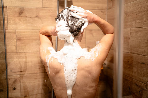 istock Woman taking a shower in bathroom 2236094469