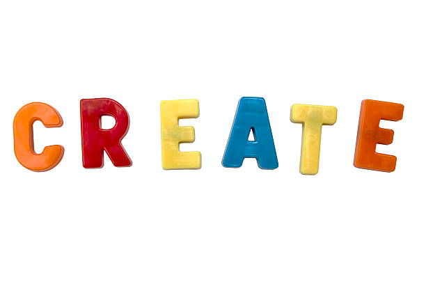 The word create is formed with bright, colorful magnetic letters, isolated against a clean white backdrop, perfect for creative concepts.
