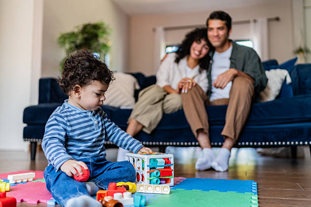 istock Baby boy playing with toys at home 2236097121