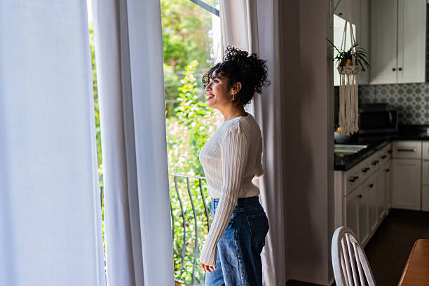 istock Young woman contemplating at home 2236100232