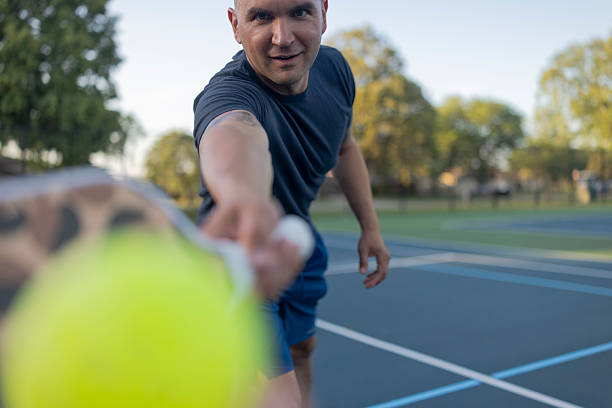 istock Athletic man hitting a pickleball and looking directly at the camera 2236104404
