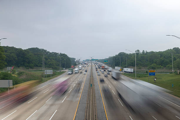 istock Busy Highway with Blurred Traffic on Overcast Day 2236104473