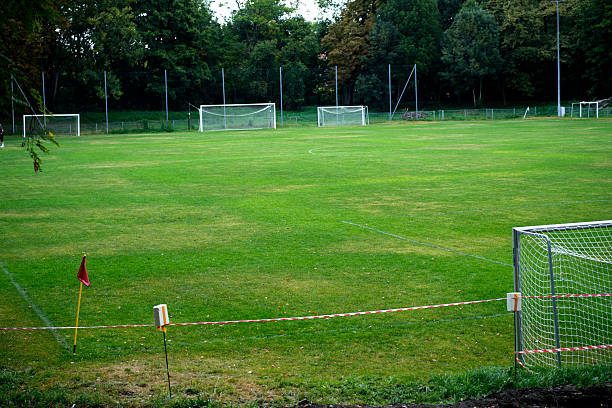 istock Football field with natural grass and corner flag 2236105608