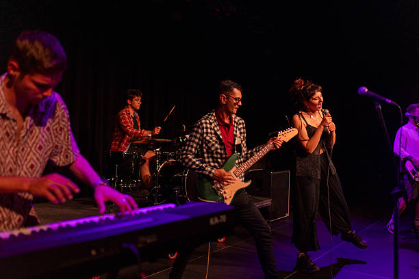 istock Energetic Live Band Performing With Passion And Excitement On Stage 2236105686