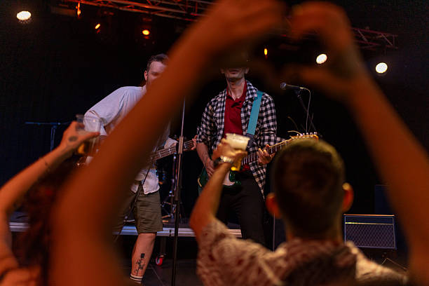 istock Energetic Live Concert Performance with Enthusiastic Audience Interaction 2236105711