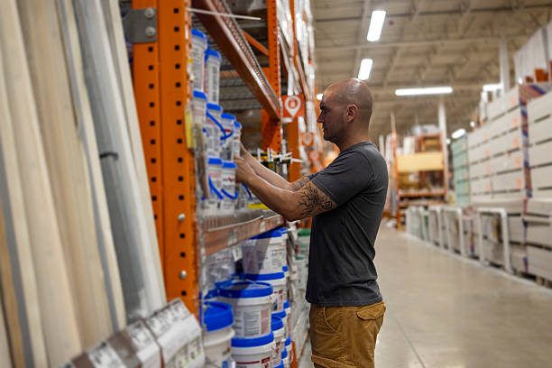 istock Man Shopping for Paint Supplies in Hardware Store 2236108877