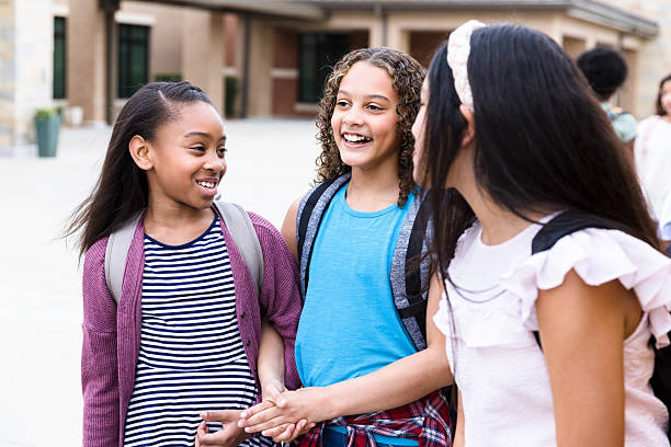 istock Happy Diverse Schoolgirls Chatting Outdoors, Friendship 2236109352
