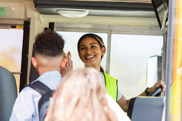 istock School Bus Driver High-Fiving Students, Cheerful Back to School 2236109355