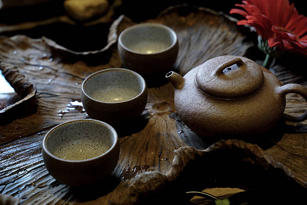 istock A rustic tea set placed on a natural wooden tray with an organic wooden table surface 2236109624