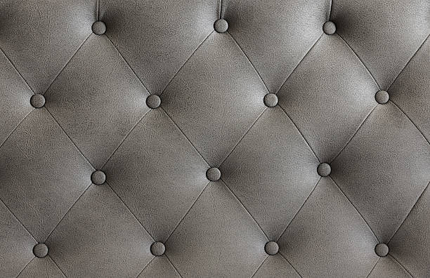 istock Closeup view of textured gray leather upholstery with elegant tufting 2236111271