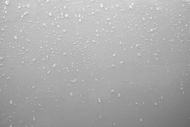 istock raindrops on the glass, gray background, raindrops on the glass 2236112194