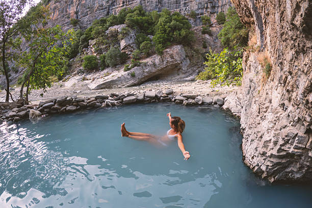 istock Woman Relaxing in Natural Hot Spring Pool 2236112847