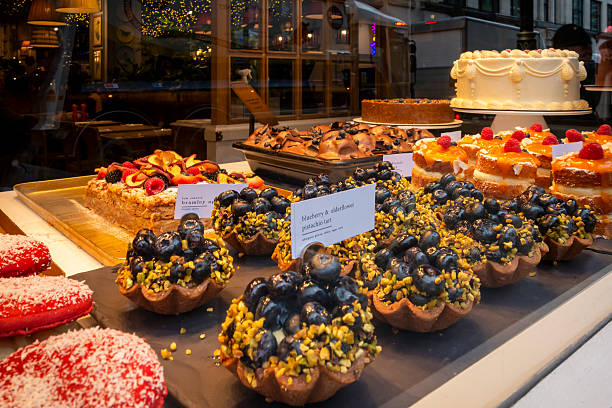 A feast of delicious desserts displayed in a cafe window in Central London.