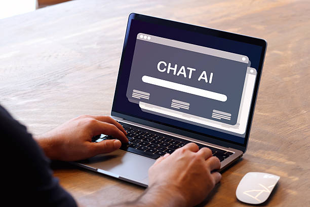 istock A person using a laptop with an AI chat interface on the screen, illustrating modern AI technology and communication. 2236116695