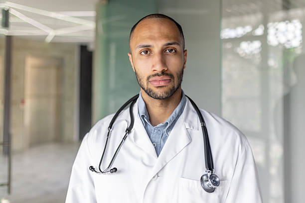 istock Professional Black doctor poses confidently with a stethoscope in a medical setting. 2236117033
