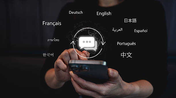 A person holds a smartphone displaying multilingual communication options, symbolizing global connectivity through language.