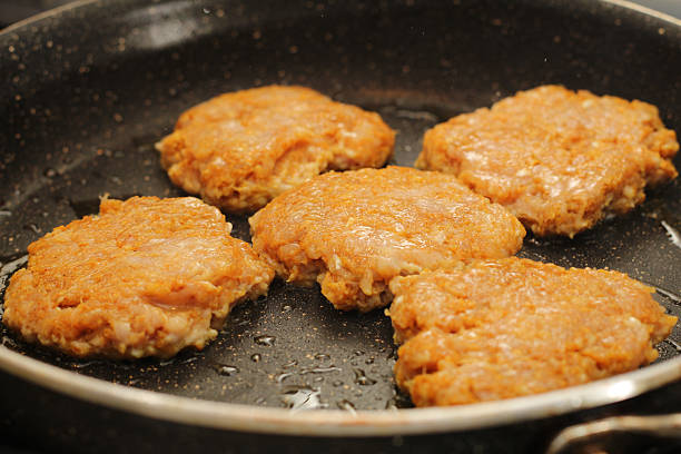 Chicken Kofta Patties Cooking on Hot Skillet