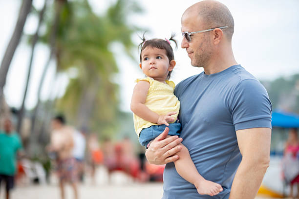 istock father and daughter spending time together and having fun at the beach 2236119214