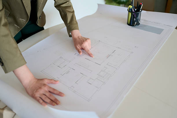 istock Architect woman planning house blueprint design project 2236120102