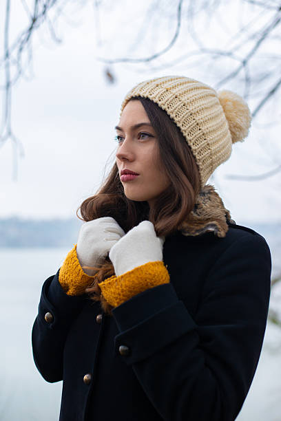 istock Young sad woman spending time in the winter nature 2236120409