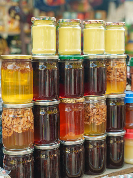 istock Assorted Honey Jars in a Market Display 2236120964