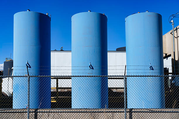 Closeup on water tower with a beautiful blue sky in the background