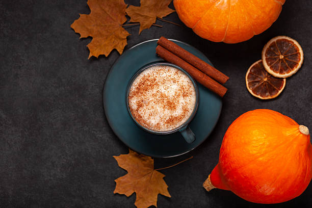istock Pumpkin spice latte with cinnamon and autumn decorations 2236121653