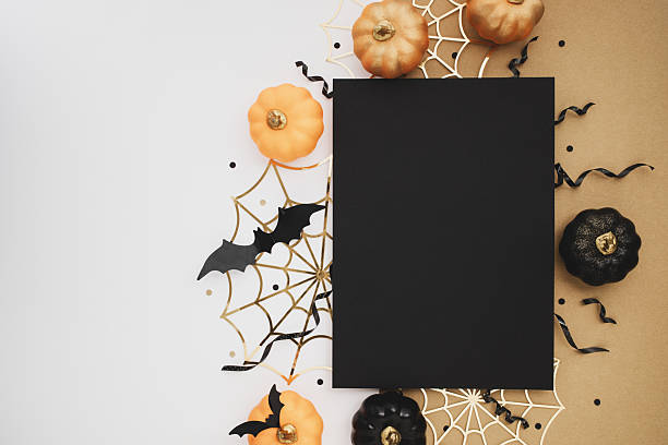 istock Halloween party template from empty black blank with festive decoration from pumpkins, bats, spider web, confetti on white and golden background top view. 2236122221