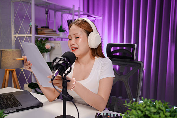 istock Podcast host recording professional audio for streaming broadcast and digital content creation in modern studio 2236122295