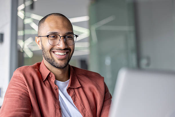istock A handsome man with glasses smiles brightly, expressing joy and happiness. 2236123330