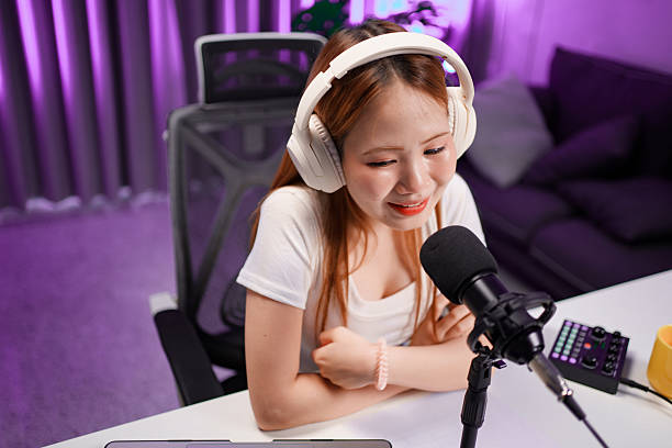 istock Podcast host recording professional audio for streaming broadcast and digital content creation in modern studio 2236129128