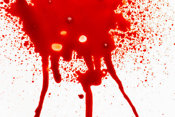Red paint on a white background.Red liquid splashes and streaks