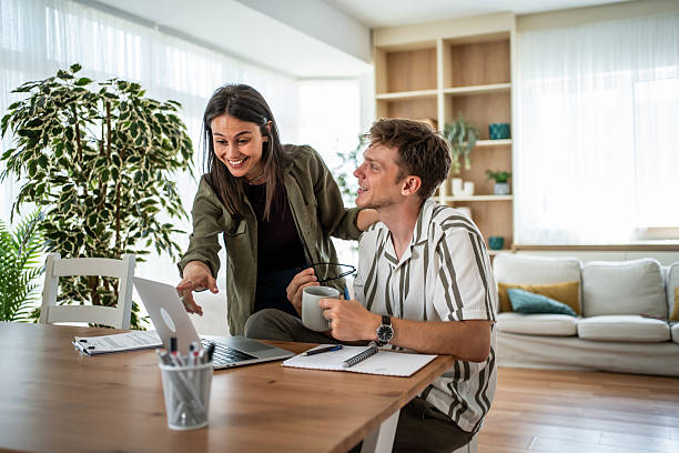 istock Couple collaborating on laptop in modern home office 2236135278
